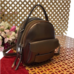 Миниатюрный сумка-рюкзачок Toffy из качественной натуральной кожи бронзового цвета.
