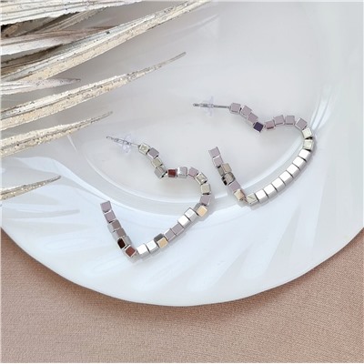 Серьги-гвоздики из стали с цирконами цвет серебристый