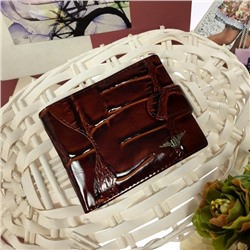 Мужской кошелек Makassar из натуральной матовой кожи цвета горького шоколада.